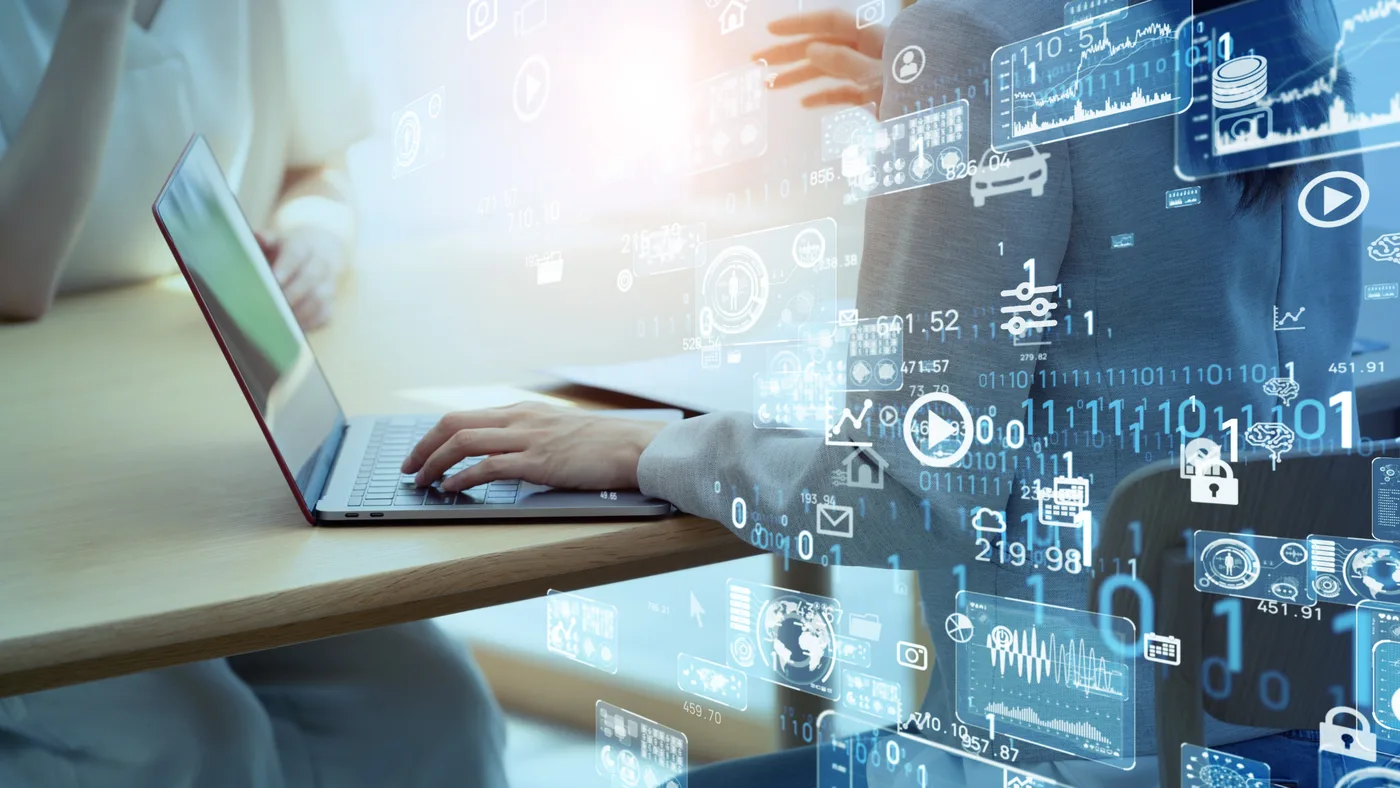 Conceptual image of a laptop with data and analytics overlays